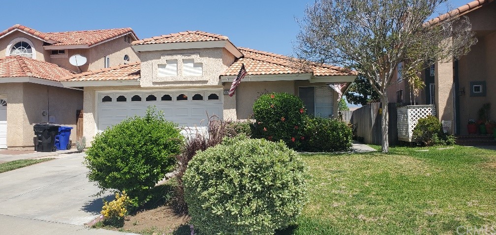 15324 Villaba Road Fontana, CA 92337 - Photo 1 of 1 a view of a house with a outdoor space and a tree