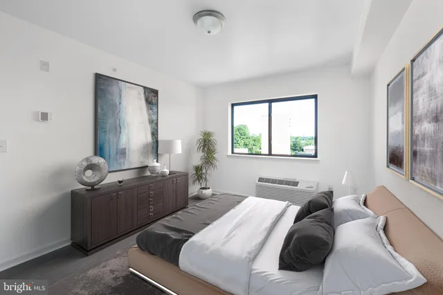 a bedroom with a bed and window