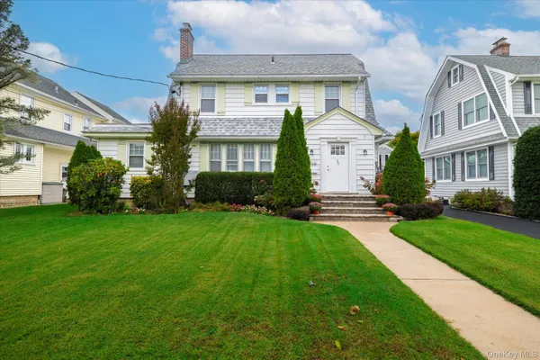 front view of a house with a yard