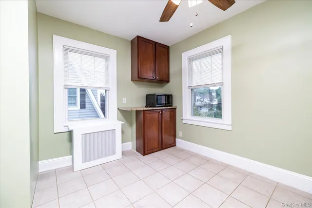 a bathroom with a sink a toilet and a window