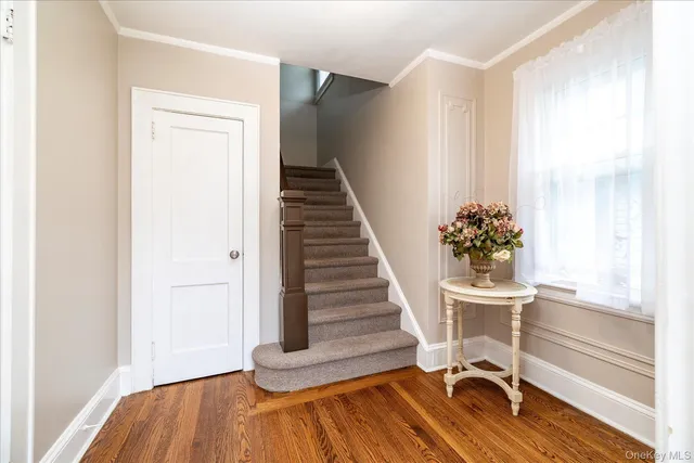 a view of a room with wooden floor and chair