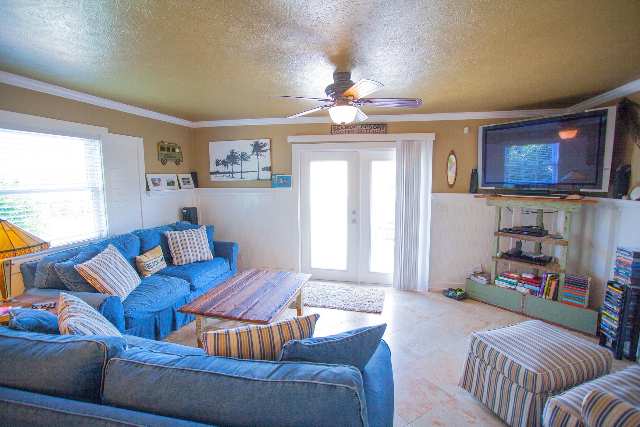 191 Blue Mountain Road, Unit 201 Santa Rosa Beach, FL 32459 - Photo 1 of 16 a living room with furniture a fireplace and a window