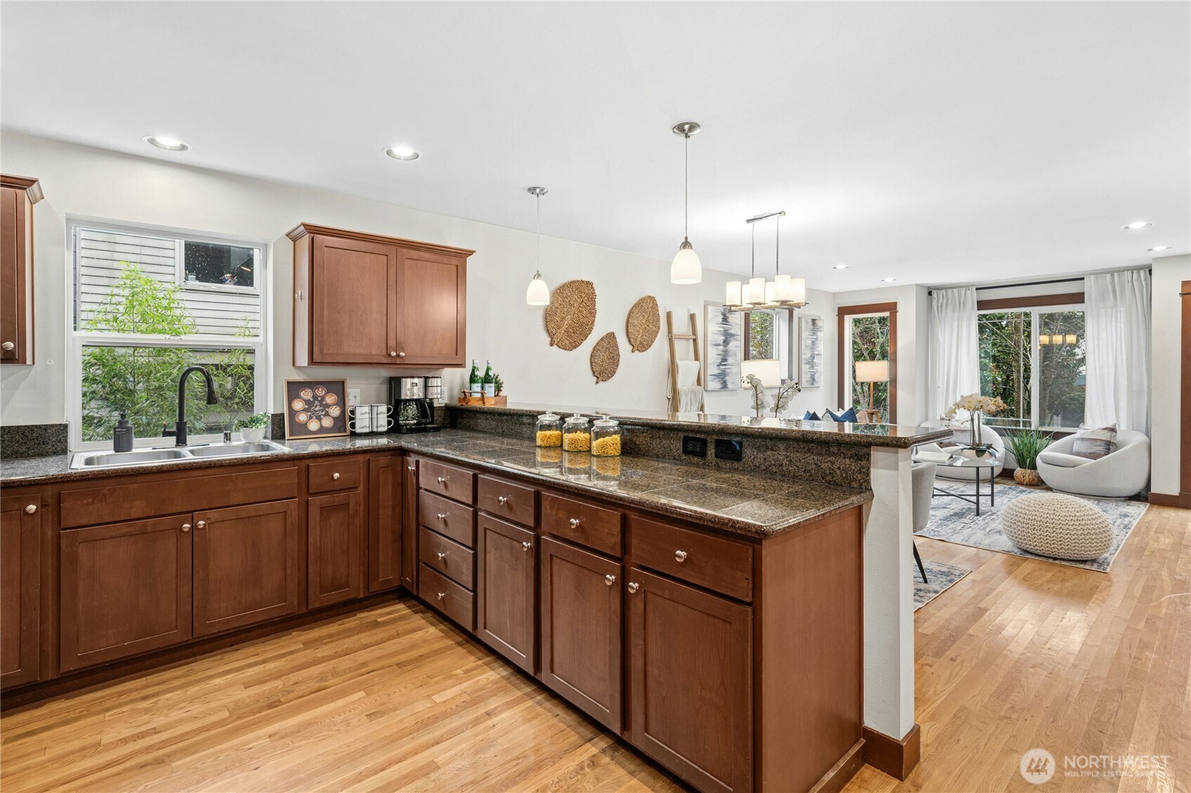 1341 14th Avenue South, Unit B Seattle, WA 98144 - Photo 13 of 26 a kitchen with stainless steel appliances granite countertop a stove and cabinets