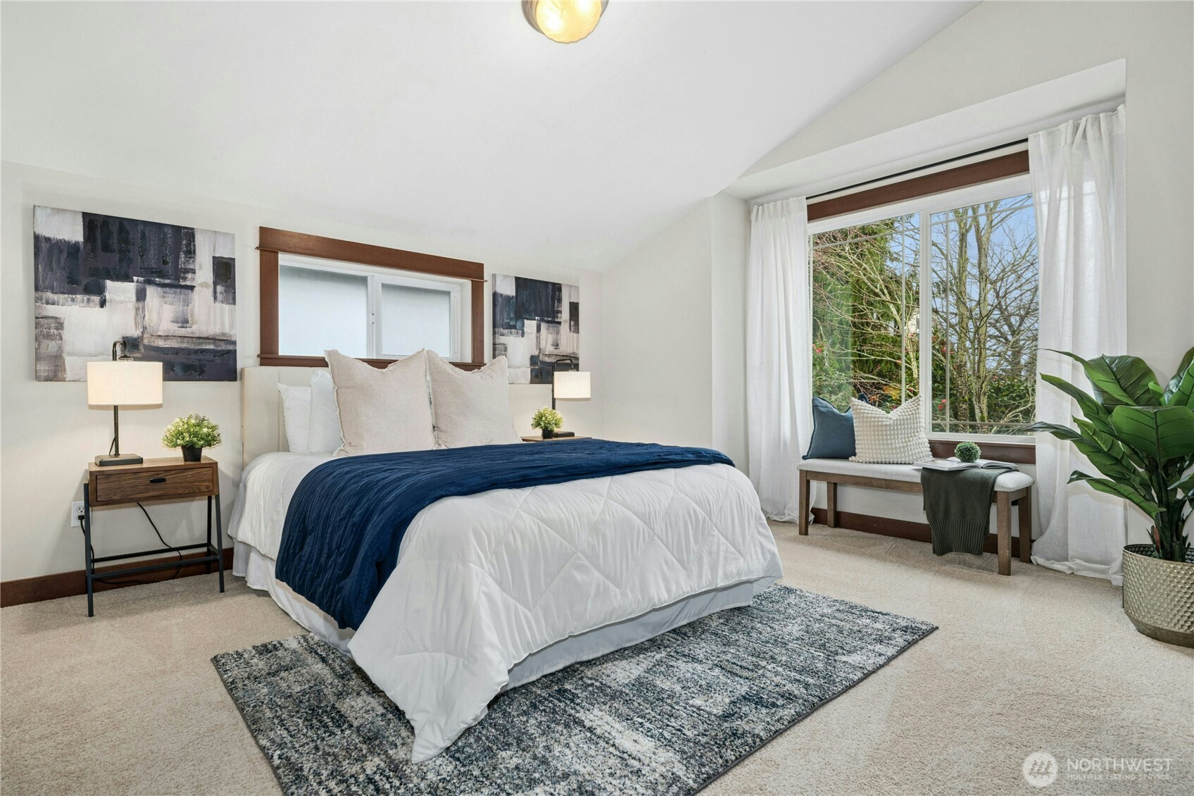 1341 14th Avenue South, Unit B Seattle, WA 98144 - Photo 17 of 26 a bedroom with a bed and a couch