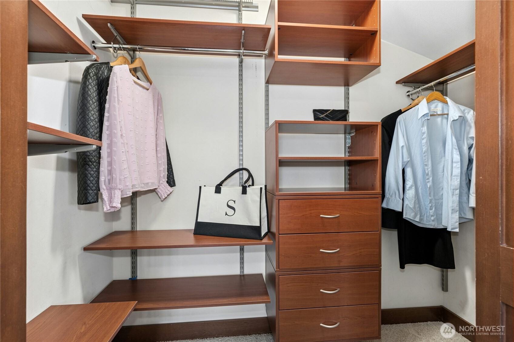 1341 14th Avenue South, Unit B Seattle, WA 98144 - Photo 20 of 26 a view of walk in closet with clothes and shoes
