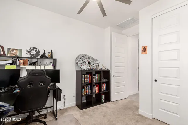 a view of a workspace with furniture