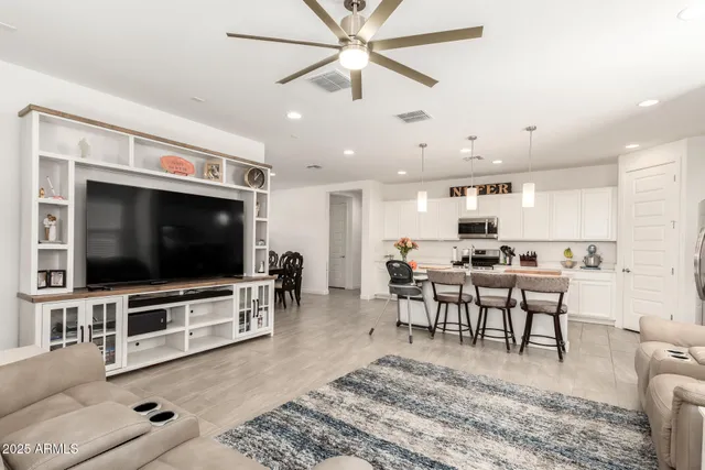 a view of a livingroom with furniture and a flat screen tv