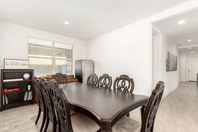 a view of a dining room with furniture and window
