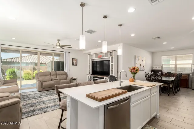 a view of a living room and kitchen view