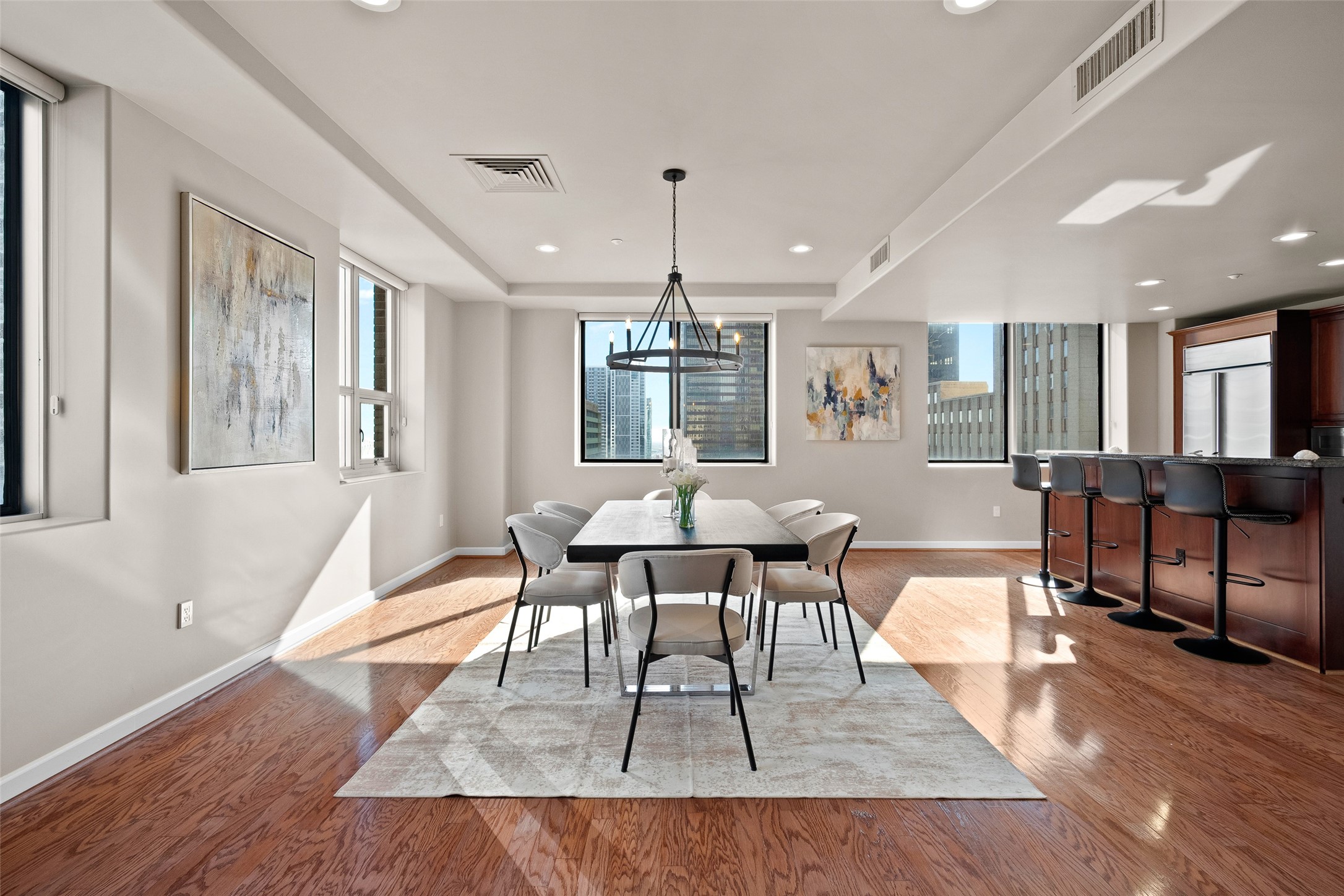 914 Main Street, Unit 1902 Houston, TX 77002 - Photo 11 of 32 a view of a dining room with furniture window and wooden floor