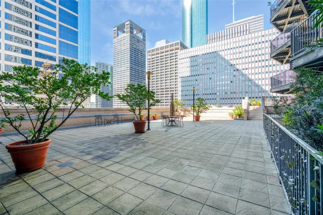 a view of a backyard with sitting area