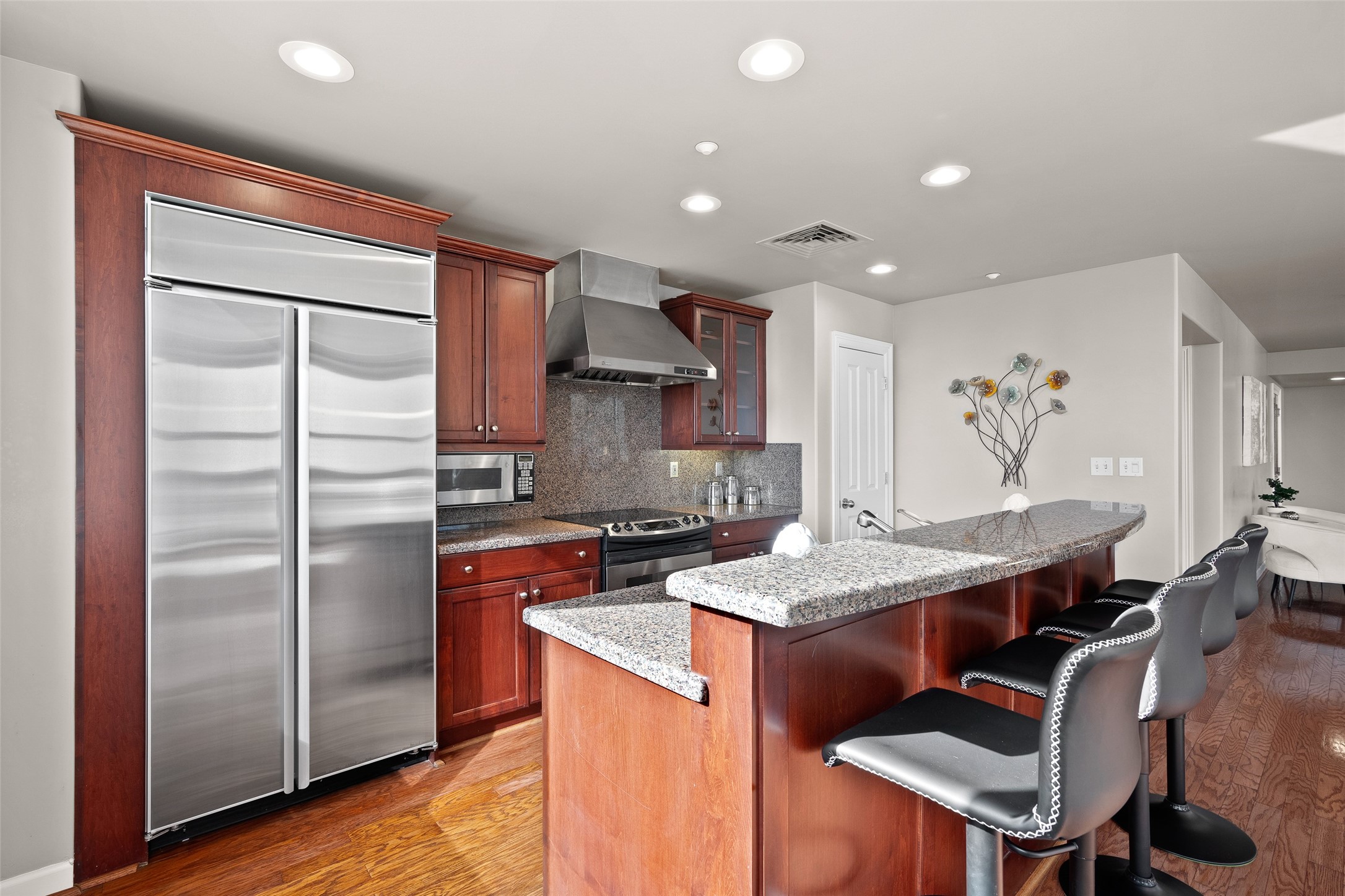 914 Main Street, Unit 1902 Houston, TX 77002 - Photo 8 of 32 a kitchen with stainless steel appliances granite countertop a refrigerator and a stove top oven