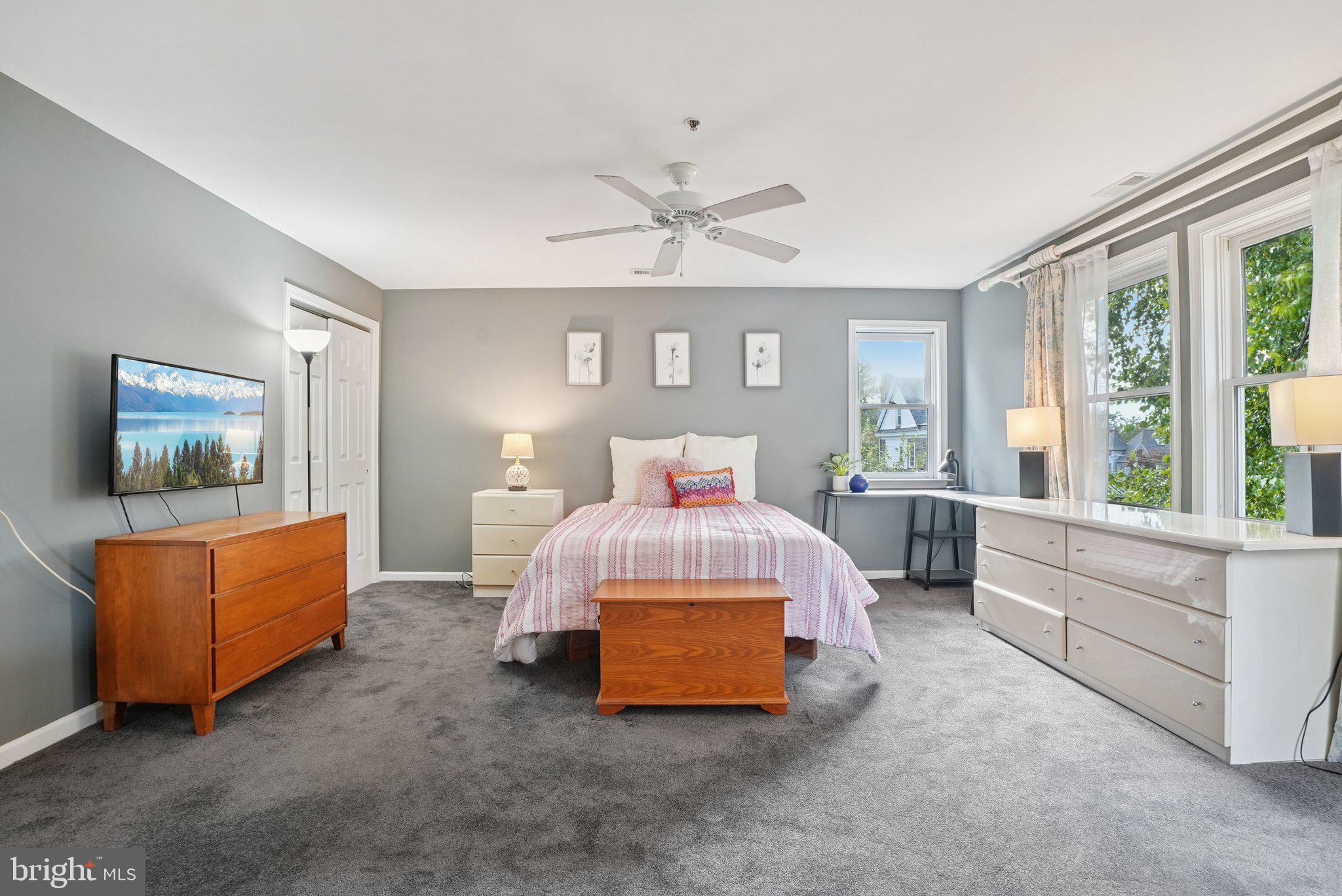 9 Comly Court Flourtown, PA 19031 - Photo 14 of 32 a spacious bedroom with a bed and a couch