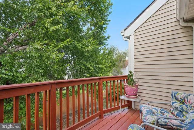 a view of a two chairs in the balcony