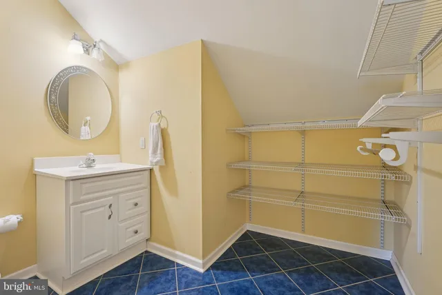 a view of a hallway with paintings on the wall