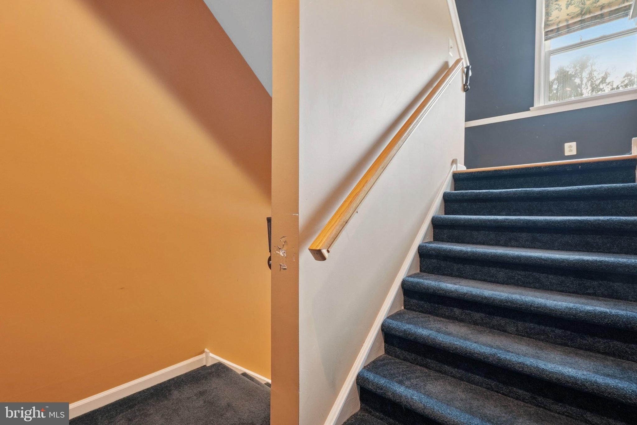 9 Comly Court Flourtown, PA 19031 - Photo 4 of 32 a view of staircase with wooden floor and white walls