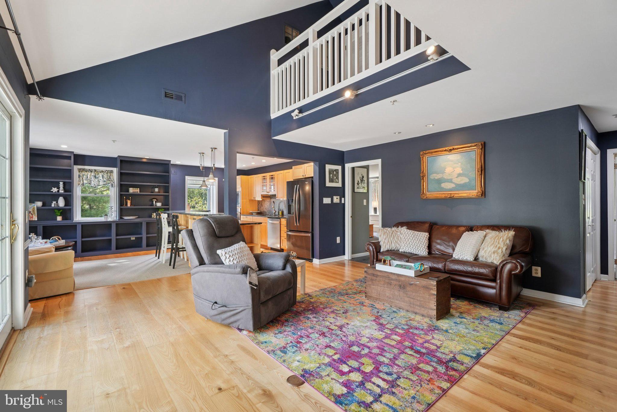 9 Comly Court Flourtown, PA 19031 - Photo 5 of 32 a living room with furniture and a floor to ceiling window