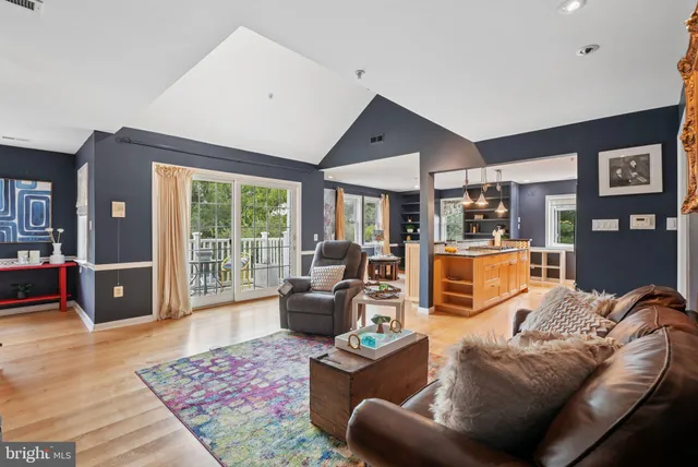 a living room with furniture and a rug