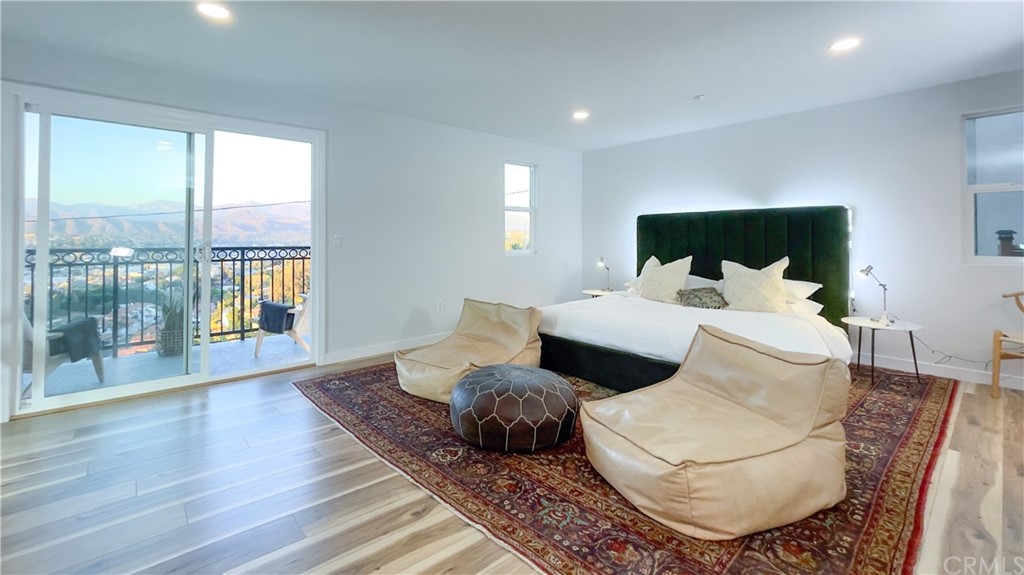 2608 Hines Drive Los Angeles, CA 90065 - Photo 16 of 38 a bedroom with a large bed and a large window