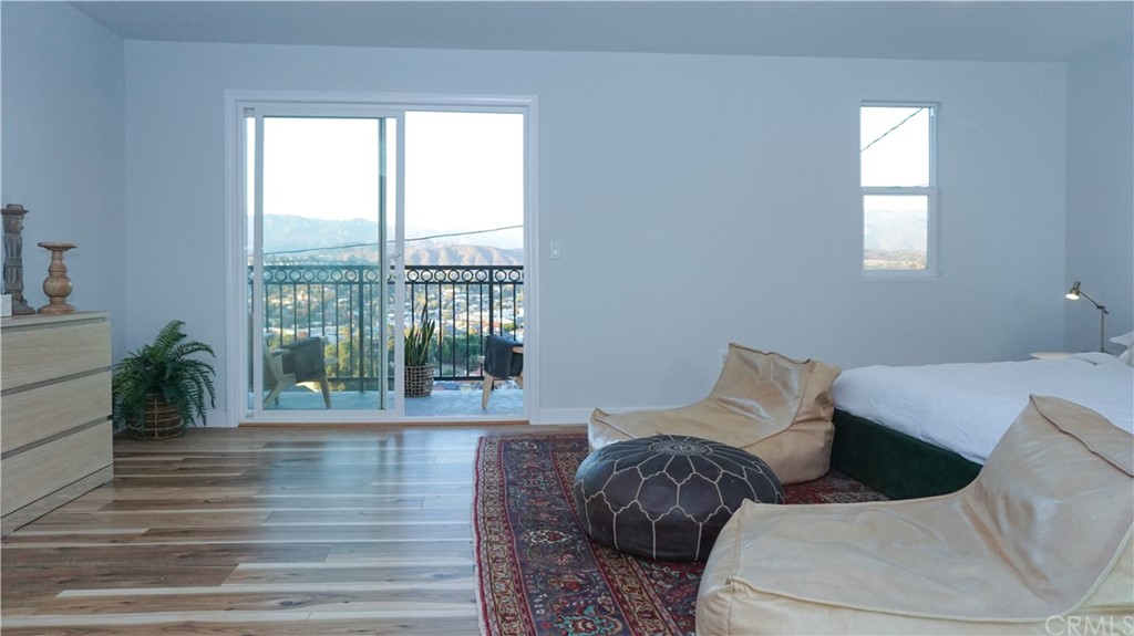2608 Hines Drive Los Angeles, CA 90065 - Photo 27 of 38 a living room with furniture and a floor to ceiling window