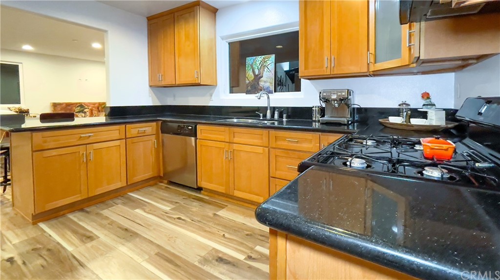 2608 Hines Drive Los Angeles, CA 90065 - Photo 30 of 38 a kitchen with stainless steel appliances granite countertop a sink stove and cabinets