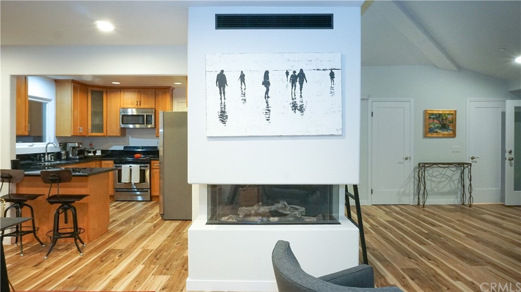 2608 Hines Drive Los Angeles, CA 90065 - Photo 37 of 38 a living room with stainless steel appliances kitchen island granite countertop furniture and a view of kitchen