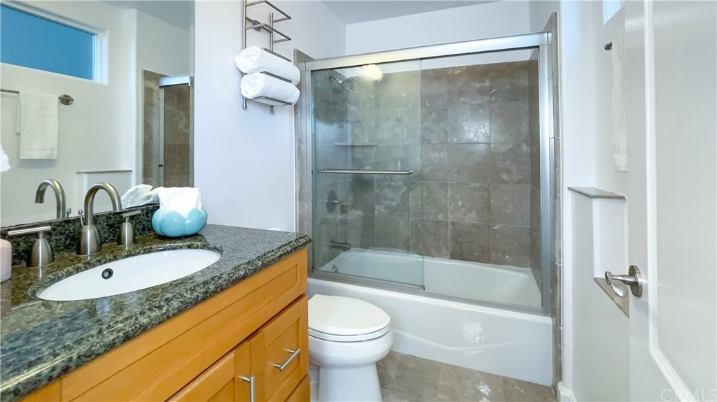 2608 Hines Drive Los Angeles, CA 90065 - Photo 7 of 38 a bathroom with a granite countertop sink toilet and shower