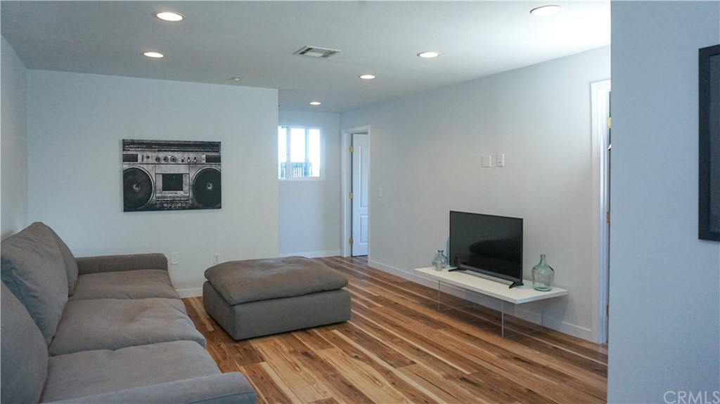 2608 Hines Drive Los Angeles, CA 90065 - Photo 9 of 38 a living room with furniture and a flat screen tv