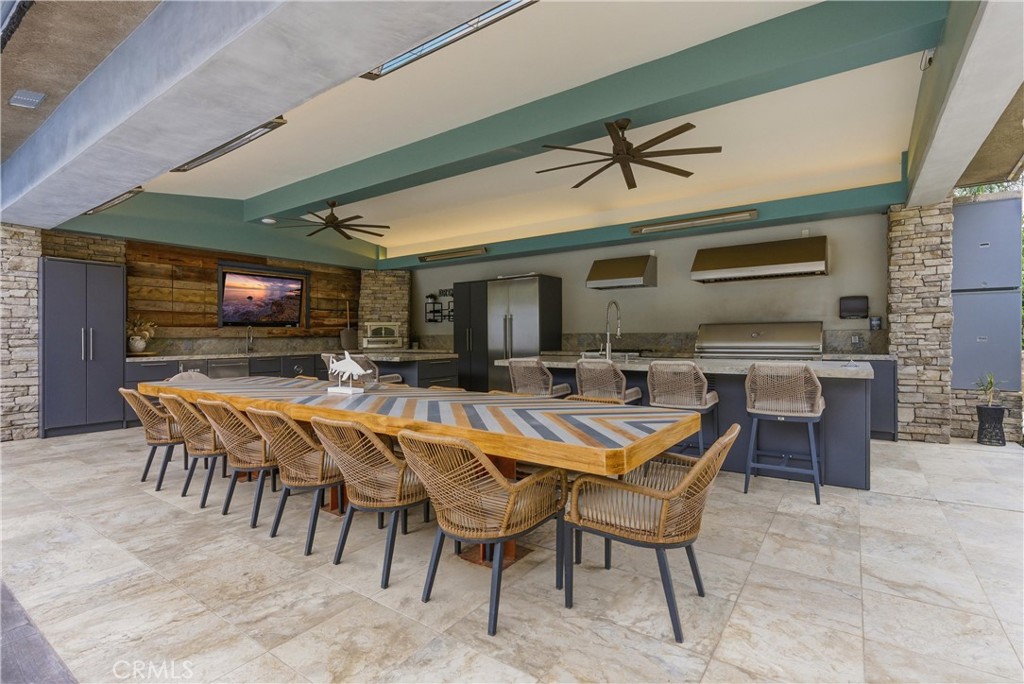 29131 Bouquet Canyon Road Silverado, CA 92676 - Photo 23 of 74 Outdoor kitchen and covered entertaining patio near pool