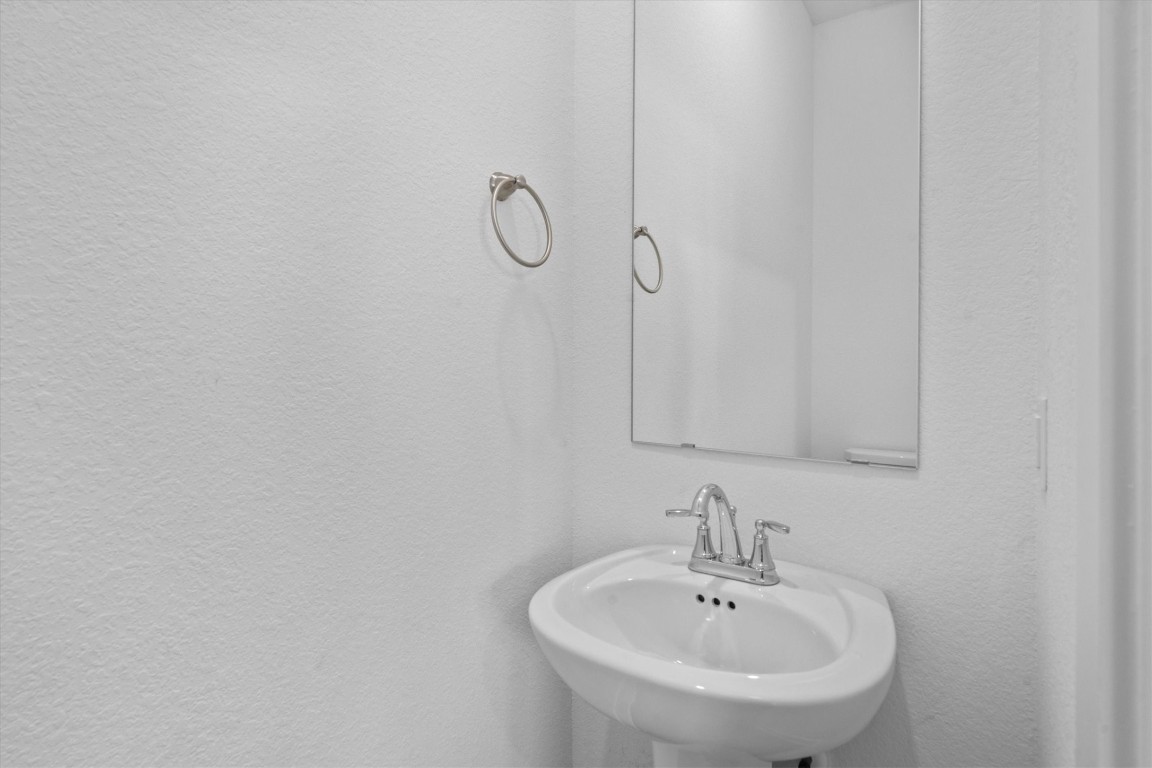 120 Red Cascade Trail Willis, TX 77318 - Photo 19 of 37 a bathroom with a sink and mirror