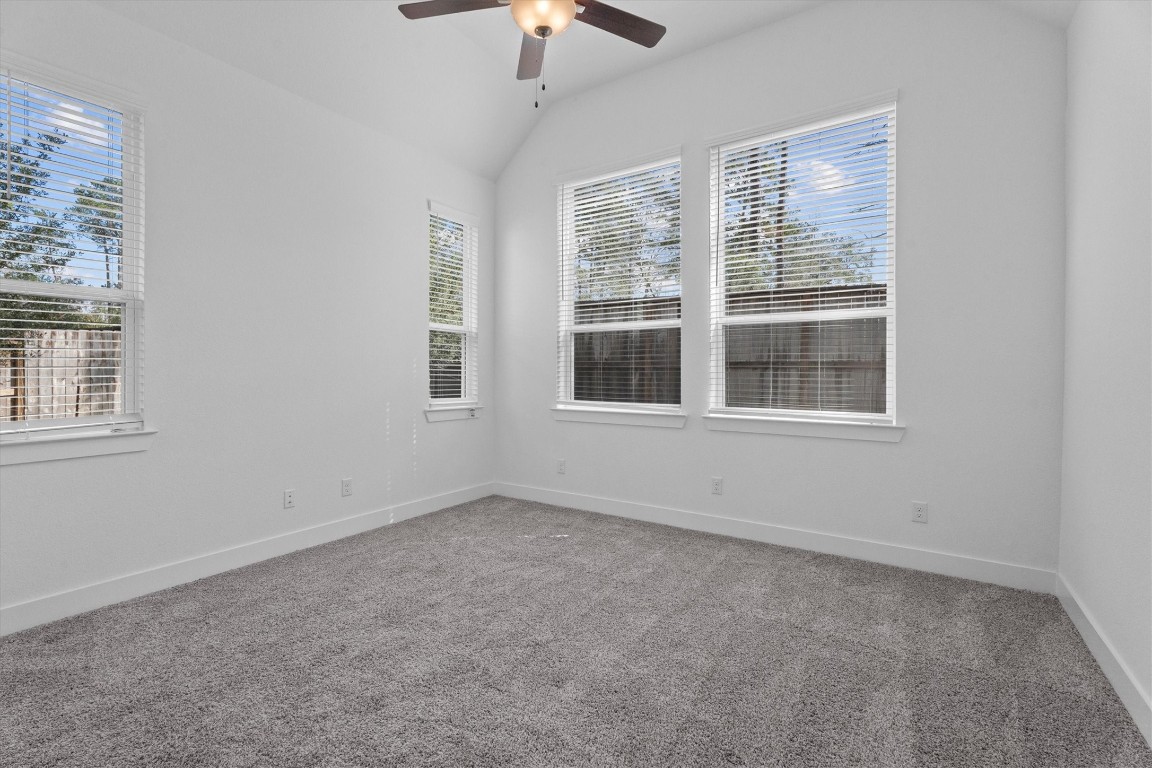 120 Red Cascade Trail Willis, TX 77318 - Photo 24 of 37 a view of empty room with windows