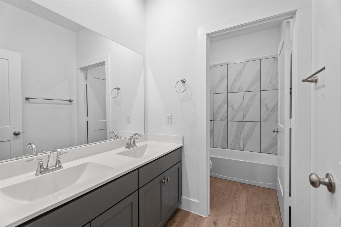 120 Red Cascade Trail Willis, TX 77318 - Photo 31 of 37 a bathroom with a double vanity sink mirror and shower