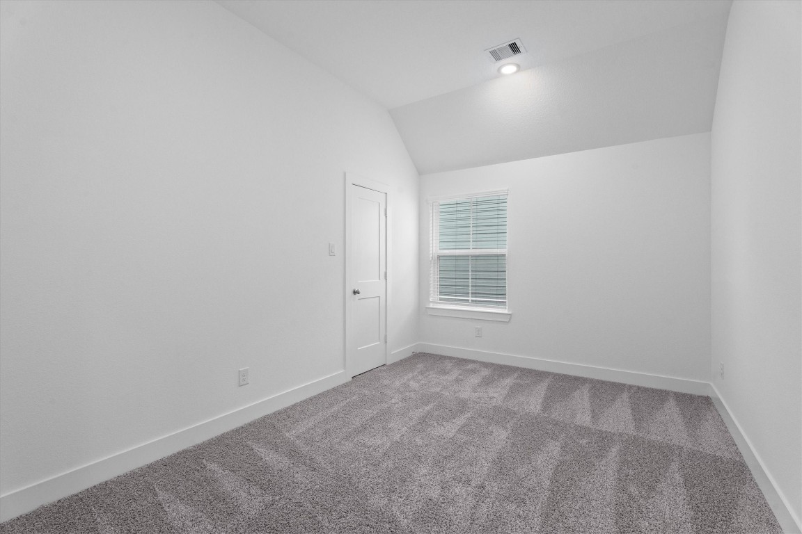 120 Red Cascade Trail Willis, TX 77318 - Photo 32 of 37 an empty room with windows