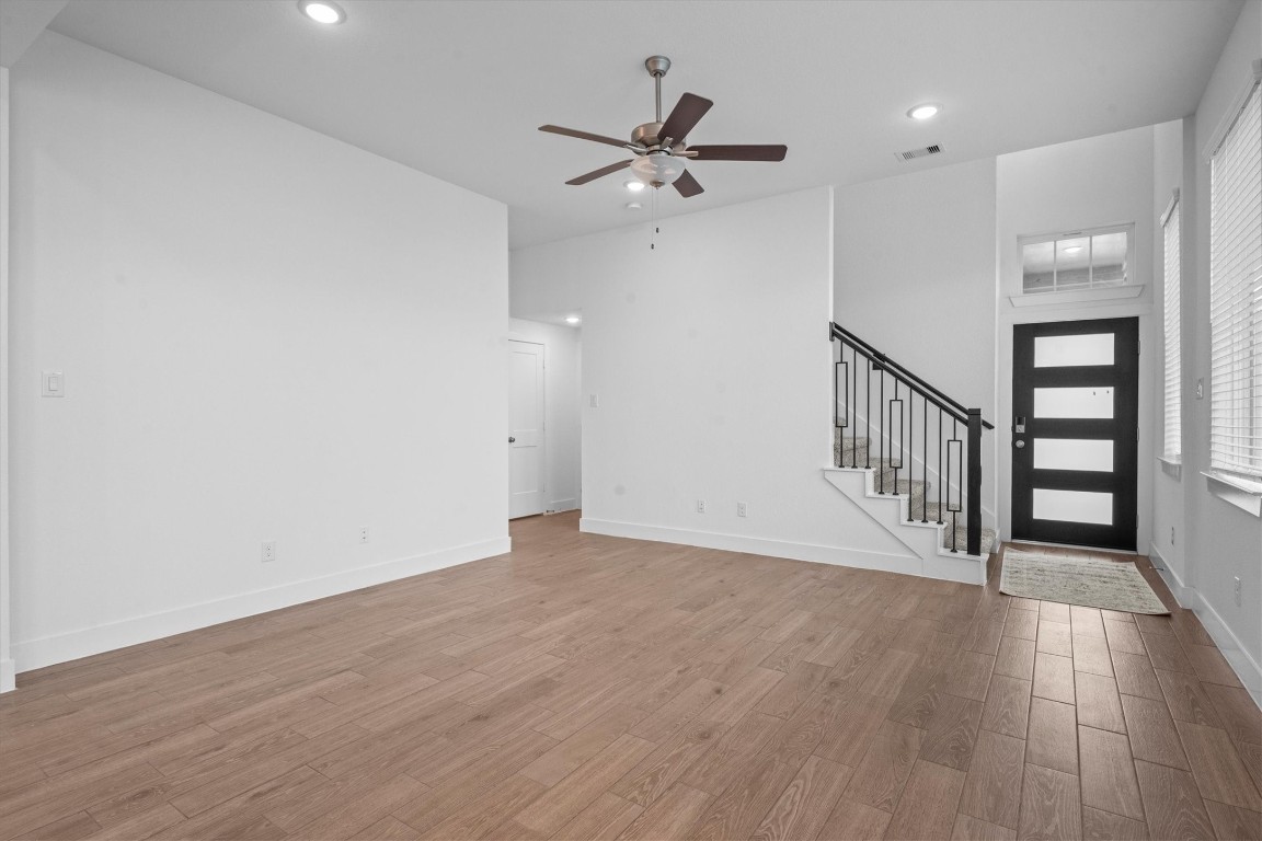 120 Red Cascade Trail Willis, TX 77318 - Photo 10 of 37 a view of an empty room with wooden floor