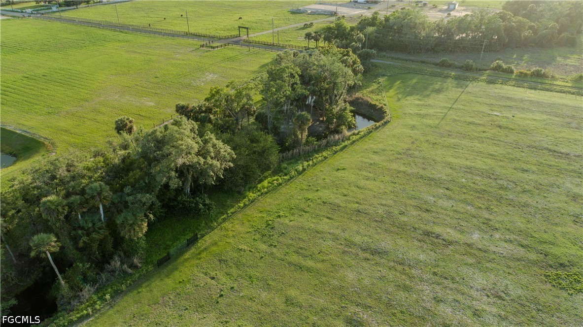 515 Norris Road Fort Denaud, FL 33935 - Photo 15 of 20 a view of a lake with a yard
