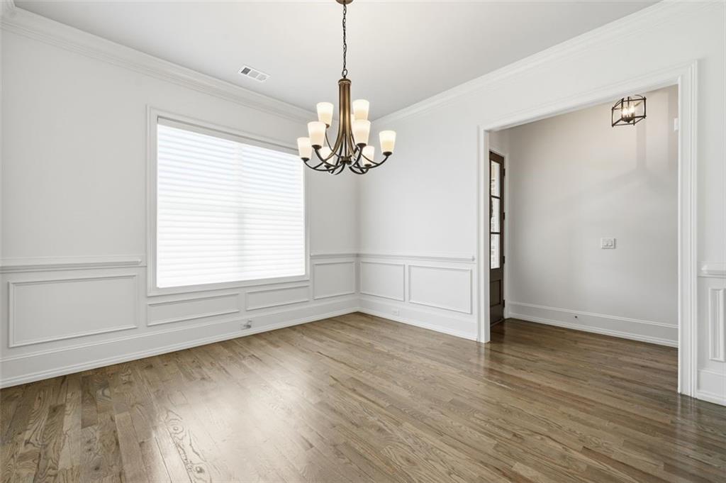 337 Rosshandler Road Suwanee, GA 30024 - Photo 5 of 45 wooden floor in an empty room with a window