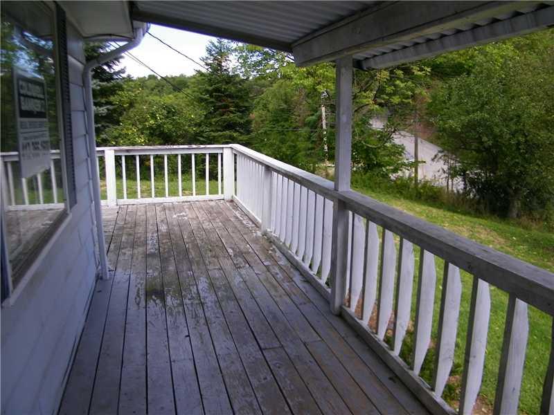 562 Shaffer Road Hookstown, PA 15050 - Photo 16 of 21 Patio/Deck. The home has a covered front porch which leads to the wrap around deck