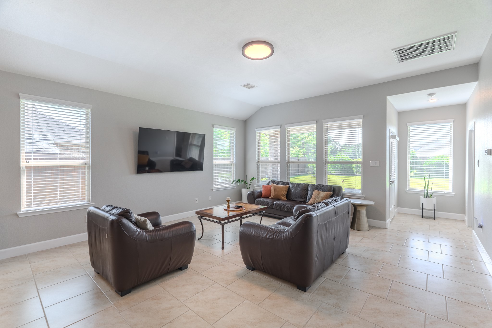 24322 North Newcastle Bay Trail Spring, TX 77389 - Photo 20 of 50 a living room with furniture and a flat screen tv