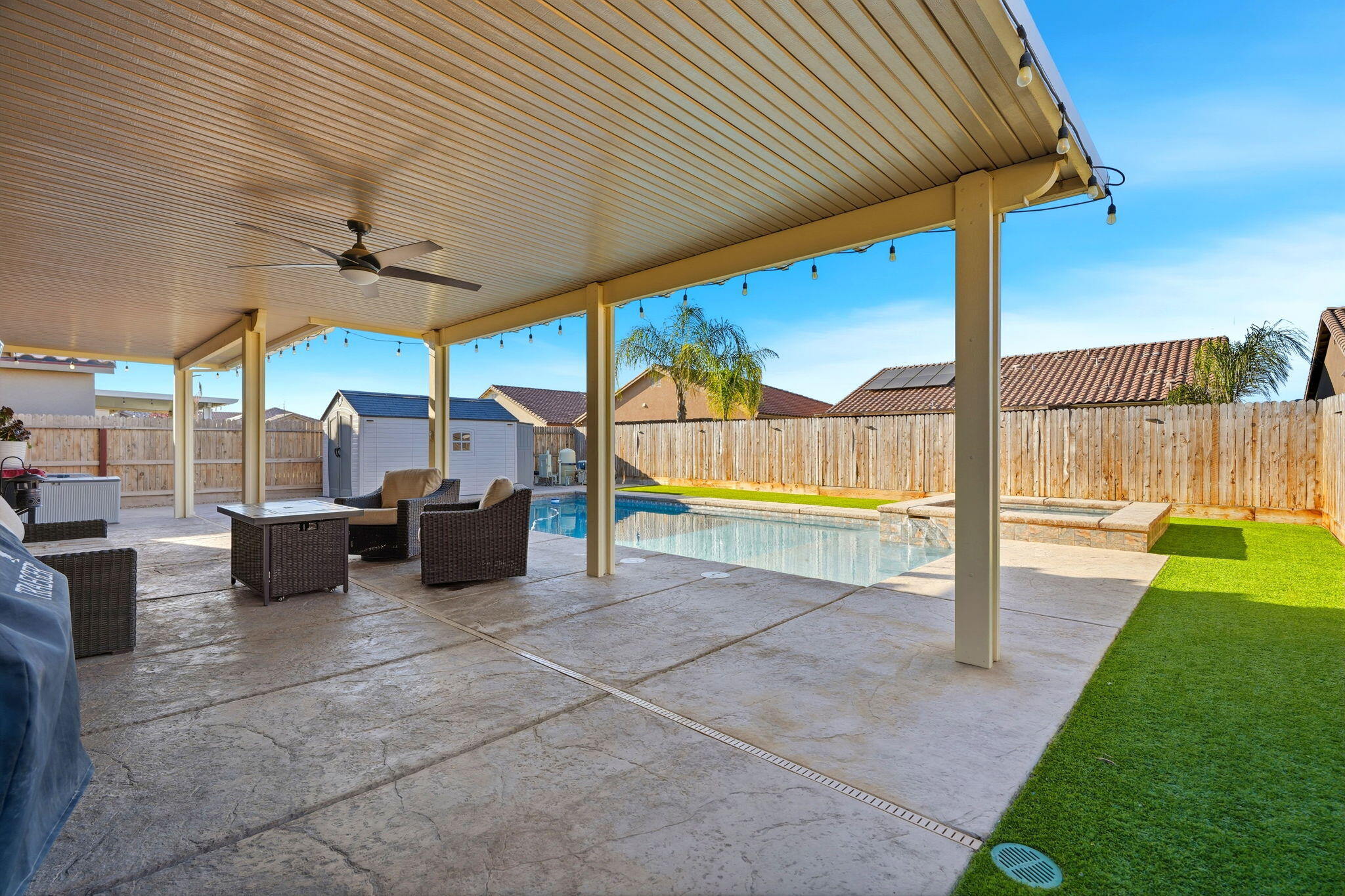 756 Strada Street Lemoore, CA 93245 - Photo 35 of 53 a view of a patio with a table and chairs