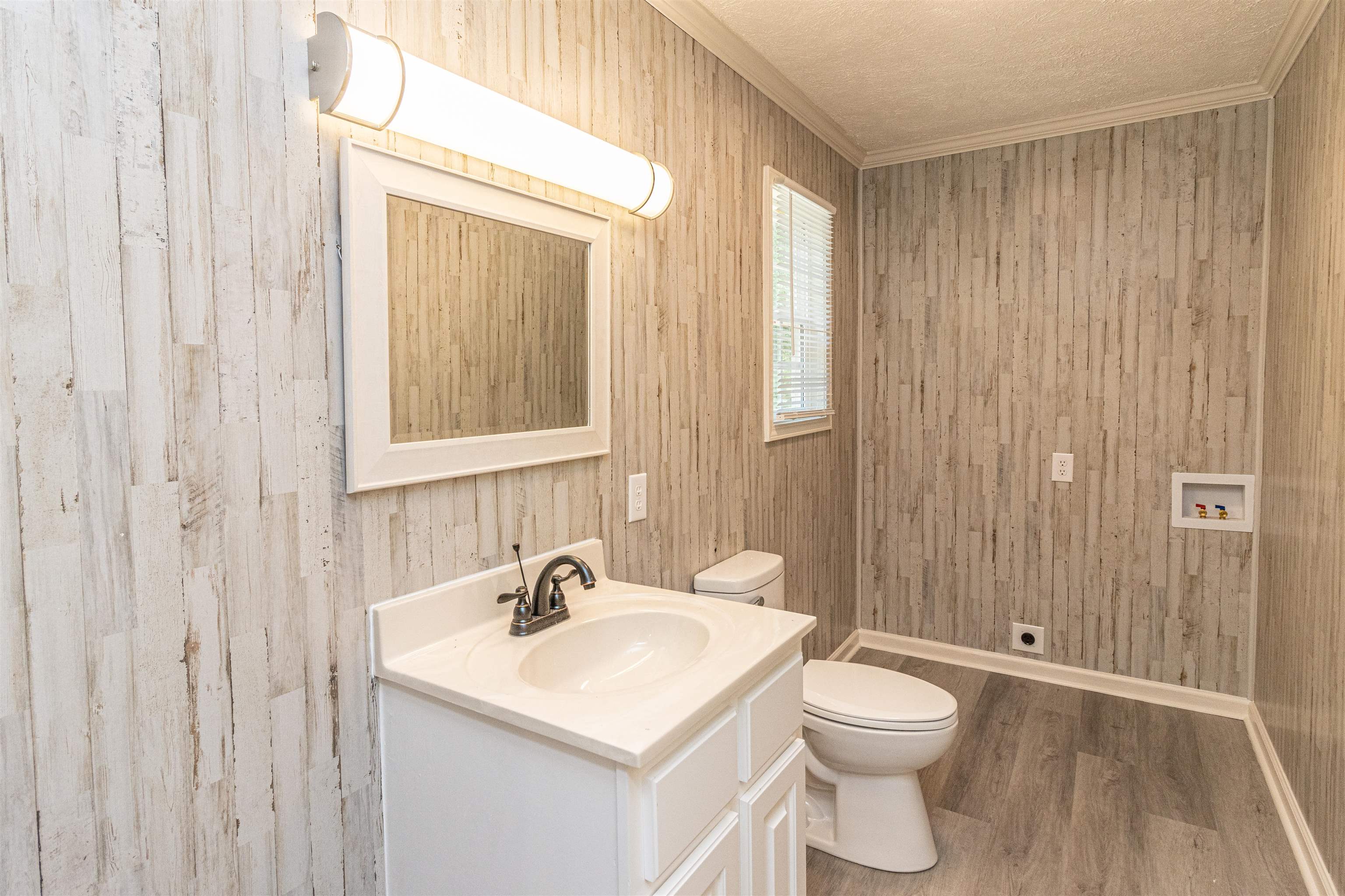 3532 Ramer Selmer Road Ramer, TN 38367 - Photo 14 of 15 a bathroom with a sink a toilet and shower