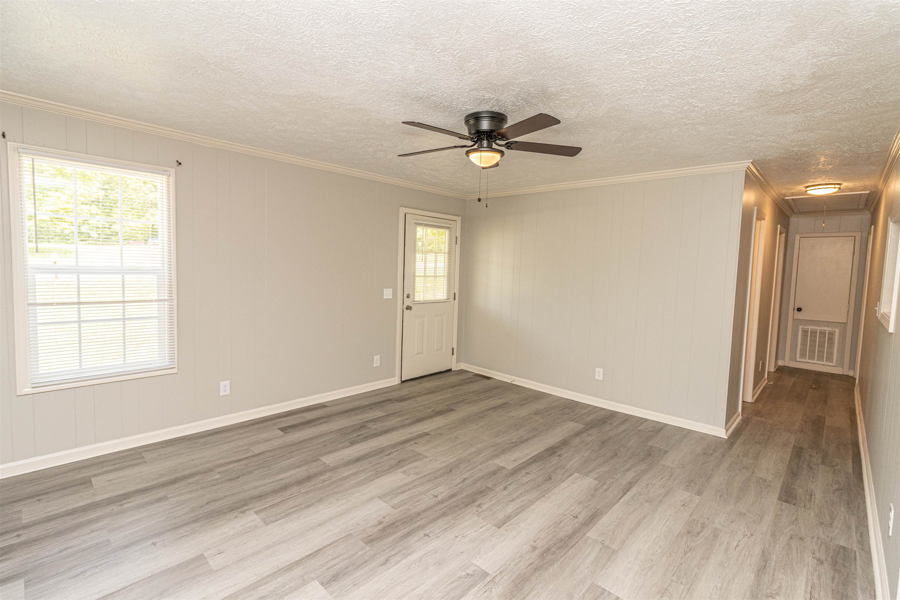 3532 Ramer Selmer Road Ramer, TN 38367 - Photo 6 of 15 a view of empty room with wooden floor and fan
