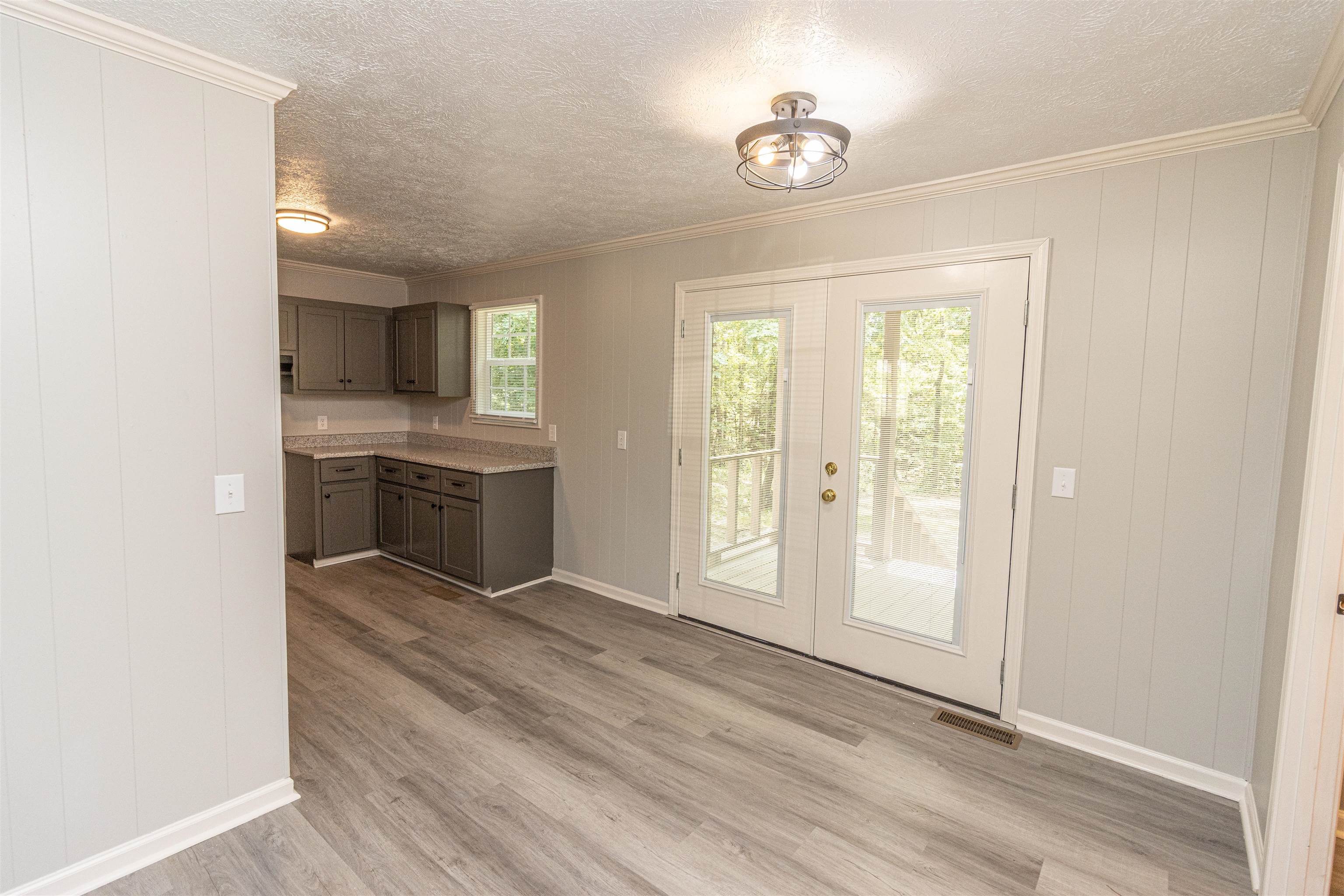 3532 Ramer Selmer Road Ramer, TN 38367 - Photo 8 of 15 an empty room with wooden floor and windows