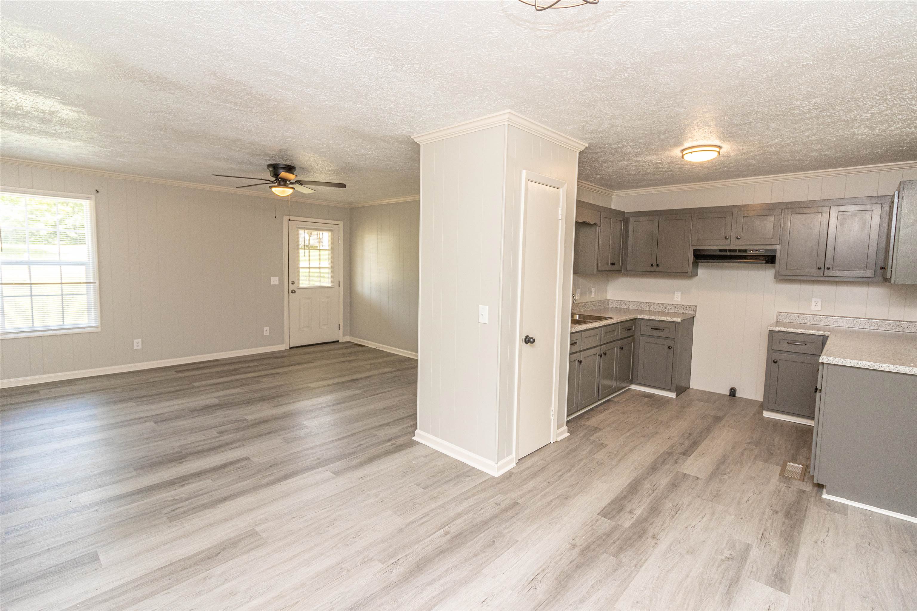 3532 Ramer Selmer Road Ramer, TN 38367 - Photo 9 of 15 a view of a kitchen with a sink cabinets and wooden floor