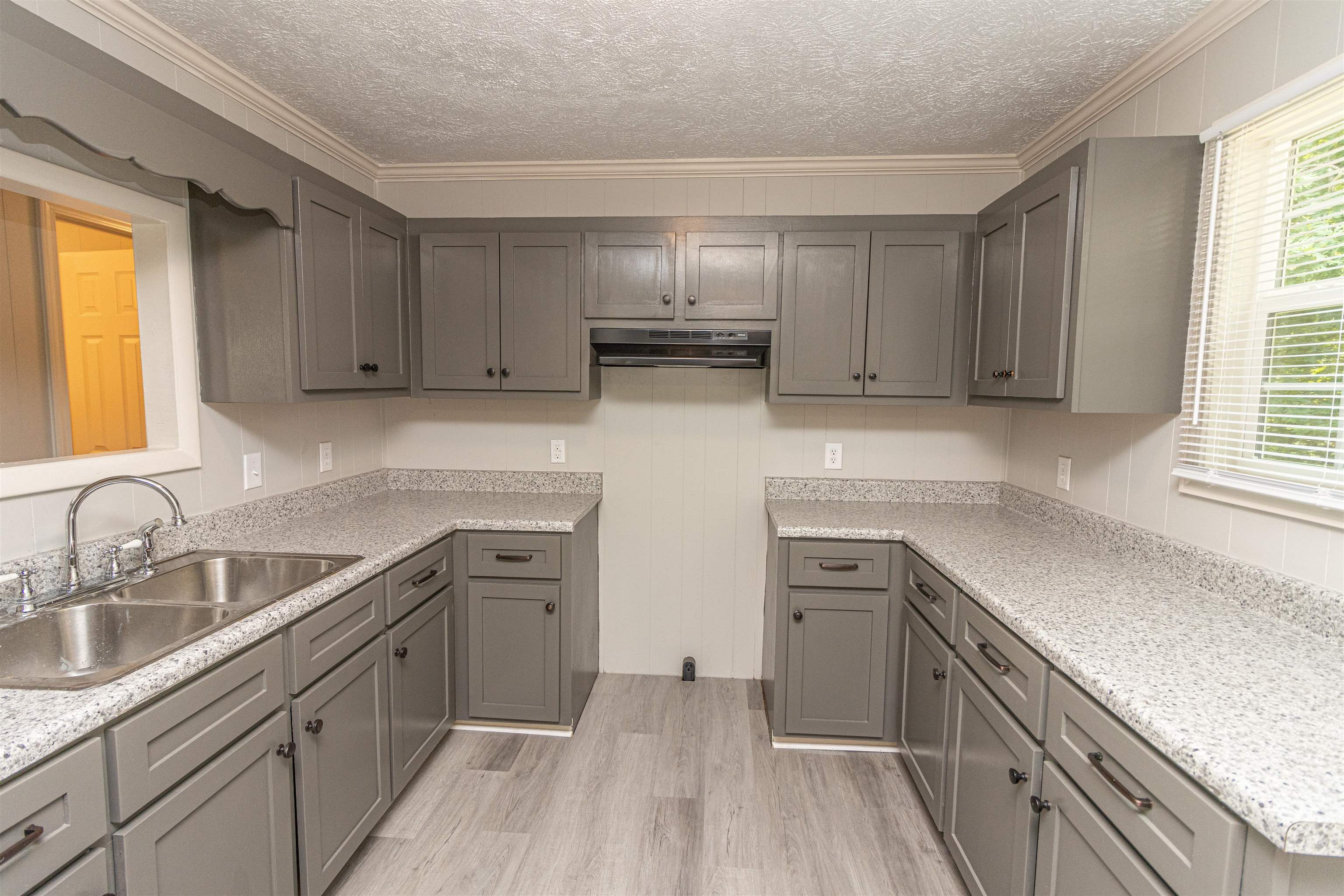 3532 Ramer Selmer Road Ramer, TN 38367 - Photo 10 of 15 a kitchen with stainless steel appliances granite countertop a sink stove and refrigerator