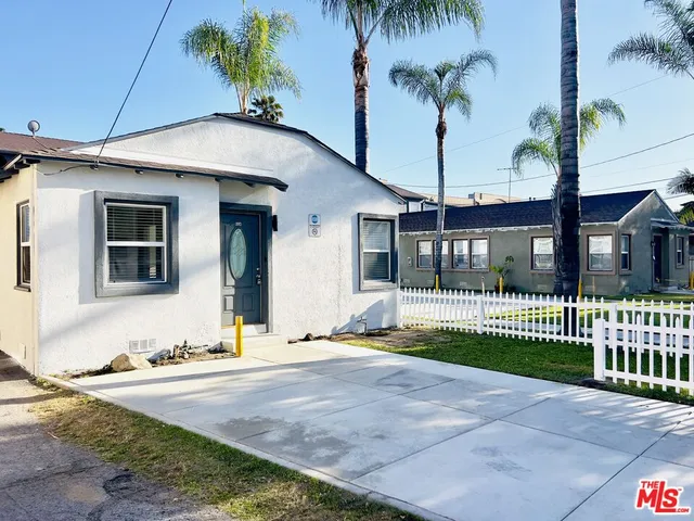 a house with swimming pool in front of it