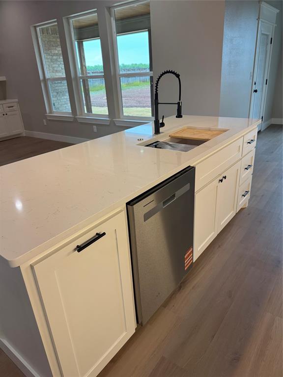 143 Ridge Road Tuscola, TX 79562 - Photo 7 of 24 a room with a sink and cabinets