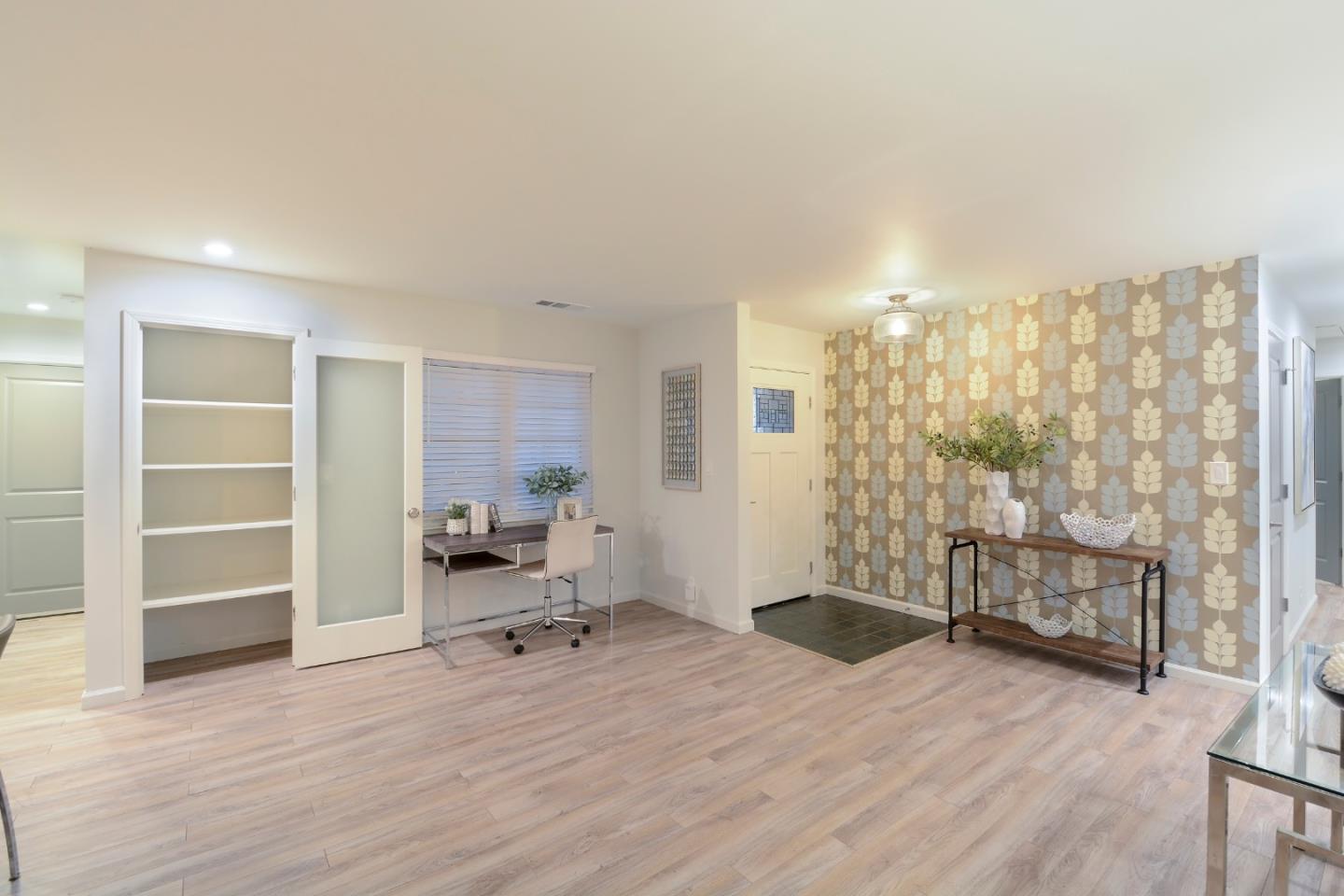 10166 Bonny Drive Cupertino, CA 95014 - Photo 11 of 46 a view of a room with gym equipment and floor to ceiling window