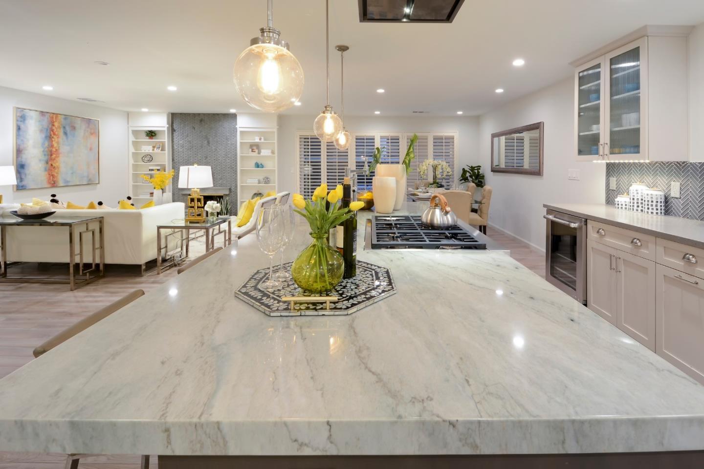 10166 Bonny Drive Cupertino, CA 95014 - Photo 14 of 46 a large white kitchen with lots of counter space furniture and kitchen view