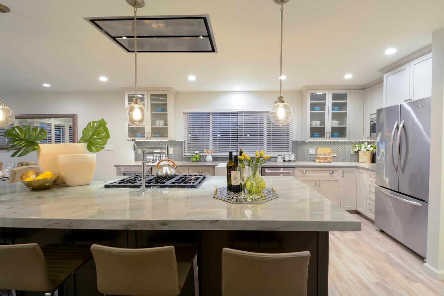 10166 Bonny Drive Cupertino, CA 95014 - Photo 15 of 46 a kitchen with sink and refrigerator