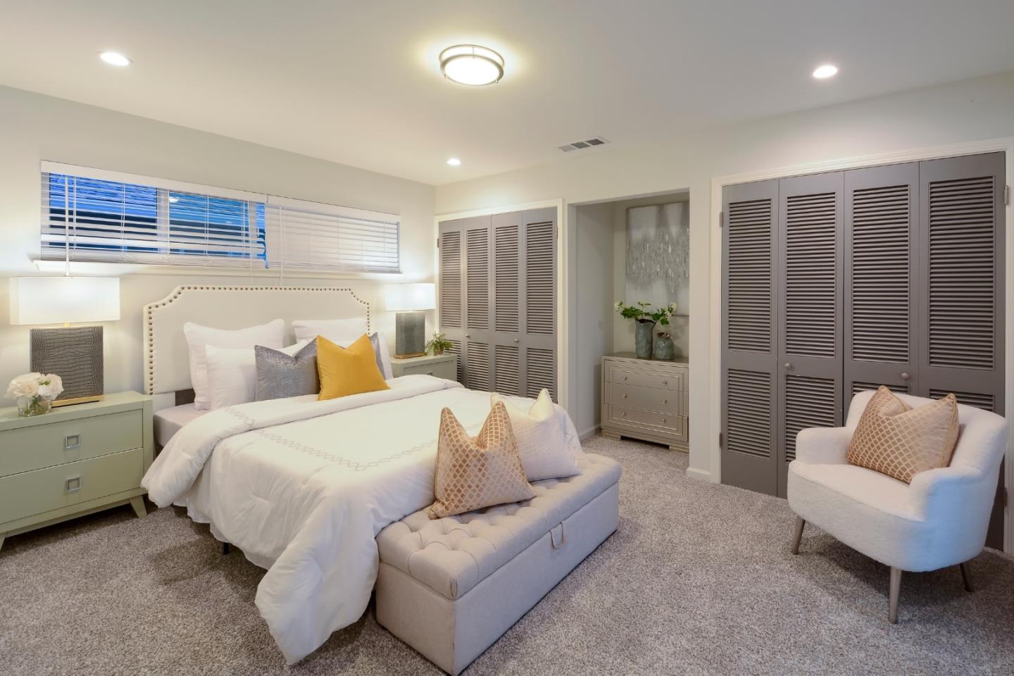 10166 Bonny Drive Cupertino, CA 95014 - Photo 17 of 46 a spacious bedroom with a bed and a couch
